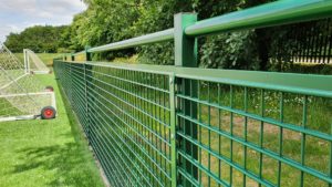 Spectator rail on a grass field
