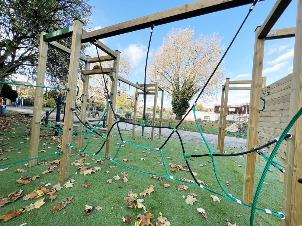 To keep boredom at bay during break times and extend outdoor educational provision, it is important to provide pupils with a variety of equipment to play on and different types of learning activities to engage in. To help, there is now a range of switchable school playground equipment. This new type of product has easily interchangeable components that you can swap over to provide new activities and challenges on a regular basis, keeping the pupils engaged. Here we look at some of the switchable play and learning equipment now available. Switchable rope climbing frames Switchable rope climbing frames come in three varieties: an apex frame, a cube frame and a square frame. You can buy these individually or in multiples to create an extended climbing activity or a climbing zone. The real advantage of these frames, however, is that they come with a variety of switchable components to offer different challenges. This means that over the course of the school year, you can mix and match the components to create endless new challenges for your pupils to have a go at. What’s more, the challenges come in three difficulty levels: simplified, intermediate and advanced. This enables you to cater for pupils of different ages or set challenges of varying difficulty for pupils to try and overcome. The challenges include climbing, traversing, balancing, swinging and more. And as there are more than 40 different rope challenge designs to choose from, the range of combinations you can create means children will always have something different to play on. The switchable rope climbing equipment is part of our interchangeable Trim Trails collection. This means you can combine the apex, cube and square frames with traditional Trim Trails apparatus to create a truly unique obstacle course for your pupils. Trim Trail components can be purchased individually, enabling you to choose the pieces that best suit your pupils and your playground design. There are over 60 different Trim Trail components available, and these are divided into three age-appropriate groups: early years, intermediate and advanced. This means younger children can have equipment that is lower to the ground and less demanding, while older pupils can go higher and take on bigger challenges. Trim Trail equipment includes items like wobbly bridges, hanging tyre challenges, shuffle bars, rope traversing, balance beams, log weavers and steppers, jungle bars and much more. Swappable panels Aside from climbing equipment, our switchable school playground equipment also includes a growing range of swappable panels that can be used for either outdoor learning or to provide creative playground activities. By erecting two sturdy wooden posts in your playground, it is possible to quickly swap these panels around whenever you need to. Posts can be placed wherever you want them and the panels at the height you need. The panels are securely fitted to the posts so they cannot be pulled off by children but can be easily removed by members of staff. For outdoor play, there are panels that can be used for chalking, playing chime bells, xylophone, rain wheel and drainpipe drums, dry-wipe drawing and colouring, story writing, painting, playing battleships, making up crosswords and playing a child-friendly version of the hangman game that features a dangling spider. For outdoor learning activities, there are specialist boards for almost every area of the curriculum. These include sum spinners and tessellation boards, weather stations, plant growers, map boards, historical timelines (e.g., Vikings, WW2, Romans and Victorians), a yoga positions board, anatomy boards, a clock board, a musical language board, an alphabet pronunciation board and abacus, handwriting and shapes boards, plus many more. All these can be put up during the lesson and easily taken down to be stored safely when not used. In between use, they can be replaced with the play boards above. Switchable school playground equipment - tabletops Our final range of switchable school playground equipment is our interchangeable, outdoor tabletops. These are fitted to the tops of either single seater or two-seater wooden tables that look like mini picnic benches. These are ideal for children that work one-to-one with a member of staff or in pairs to practice particular skills and can be used with a standard dry wipe pen. The swappable tabletops include two different handwriting practice boards, one with gradually smaller lines to encourage smaller, neater handwriting; and a board for practising modern foreign languages. This has seats on either side so two people can write and speak to each other using a different language at the same time. Conclusion Switchable school playground equipment enables schools to offer a wider range of playground and outdoor curriculum activities and in doing so, can save space and cut the cost of installing lots of separate apparatus. As a result, it can help keep children engaged during free time and extend the school’s provision of the outdoor curriculum. For more information visit our Interchangeable Trim Trails or Educational Panels pages.